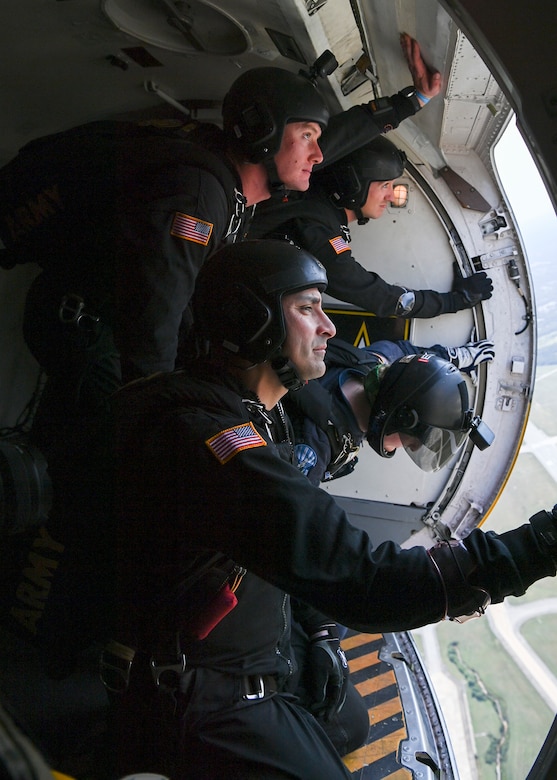 The U.S. Army Parachute Team, the “Golden Knights” and a member of the U.S. Air Force Academy “Wings of Blue” await to jump from a C-147A at the Joint Base Andrews 2022 Air & Space Expo at JBA, Md., Sept. 17, 2022.