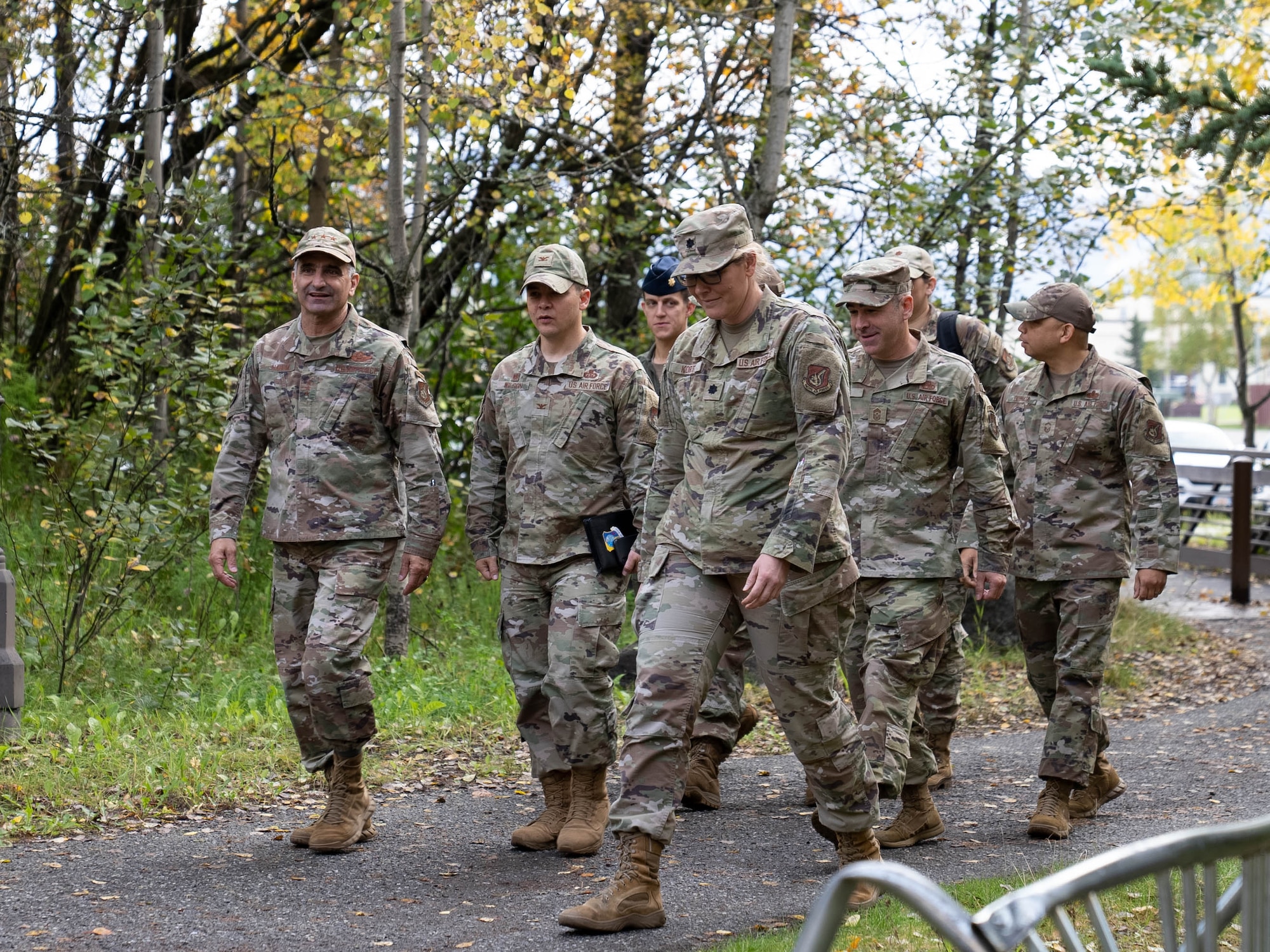A photo of a group of Air Force members walking towards the dinning facility.