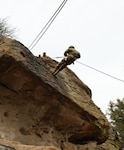 U.S. Army Sgt. Oualala Coulibaly, 1st Infantry Division Main Command Post-Operational Detachment, rappels down a cliff face while U.S. Army Sgt. Maj. Jon Crowe coaches him during military mountaineering sustainment training at Castlewood Canyon, Colorado, Apr. 9, 2022. The MCP-OD is attached to the 1st Infantry Division with a mission to increase capacity and extend operations and support for the Main Command Post and the Division Headquarters and Headquarters Battalion.
(U.S. Army National Guard photo by Sgt. 1st Class Joseph Labutka).