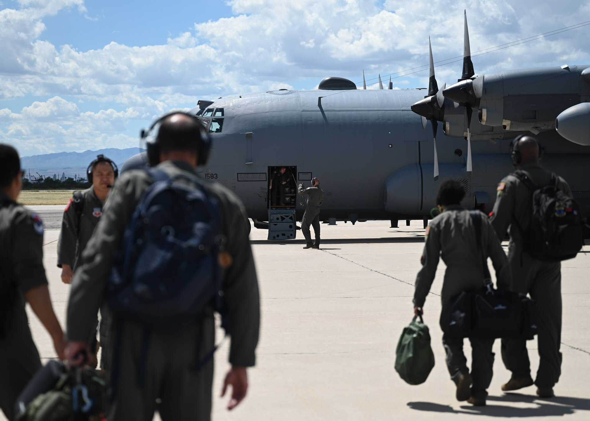 A photo of Airmen walking to an aircraft.