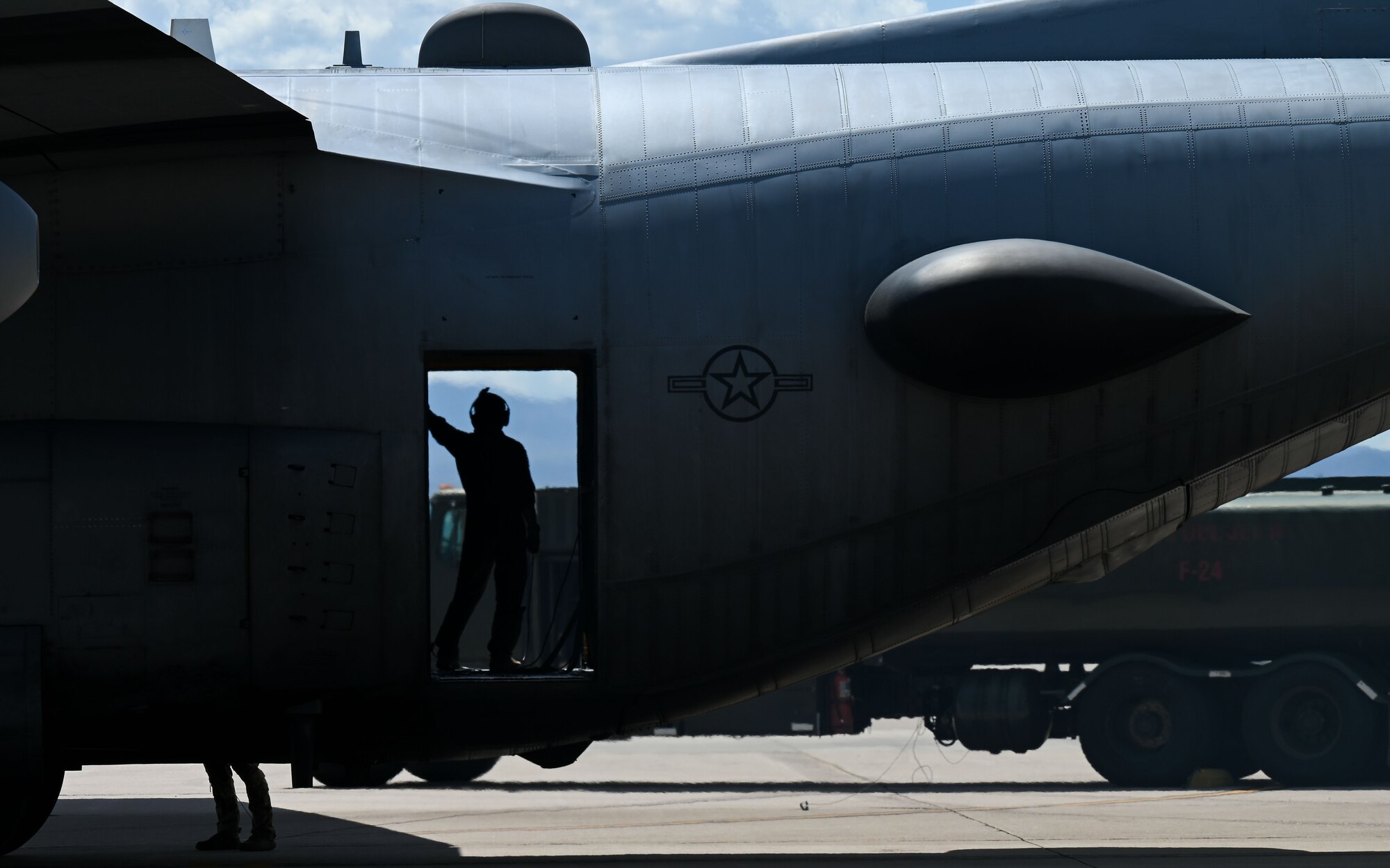 A photo of an Airman on an airplane.