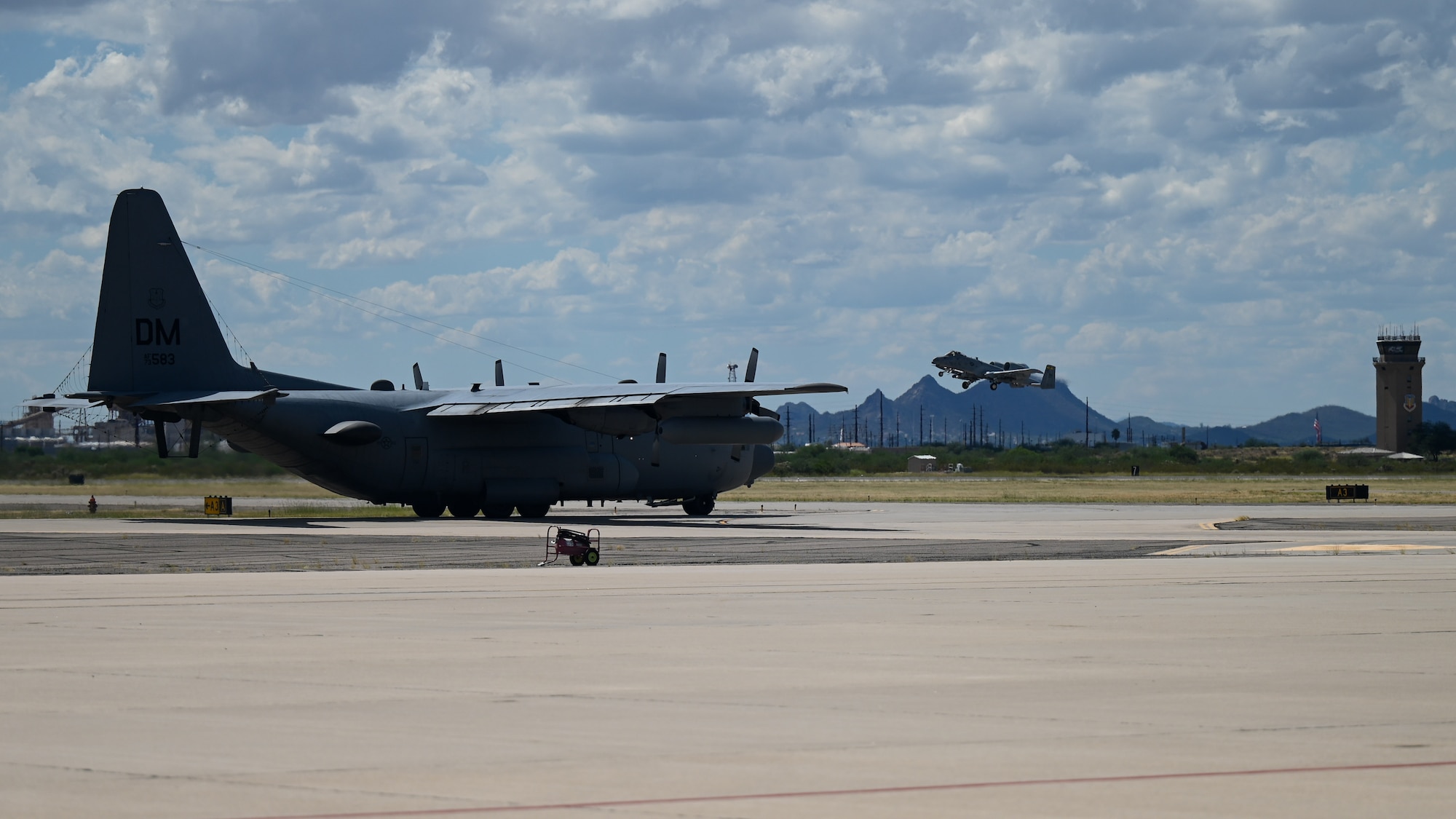 A photo of two airplanes.