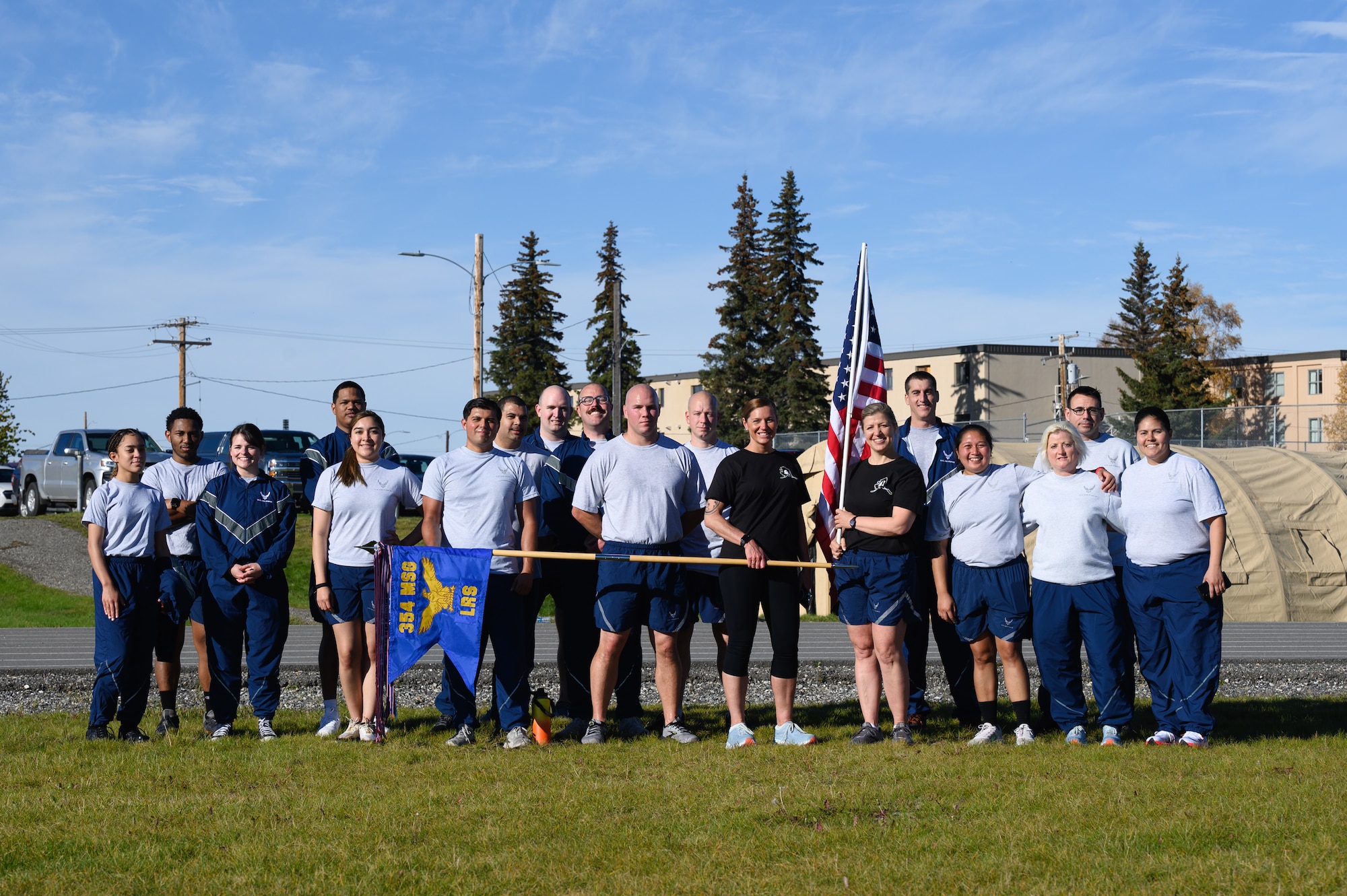 U.S. Airmen assigned to the 354th Logistics Readiness Squadron pose for a group photo during the Prisoners of War/Missing in Action remembrance run on Eielson Air Force Base, Alaska, Sept. 16, 2022.