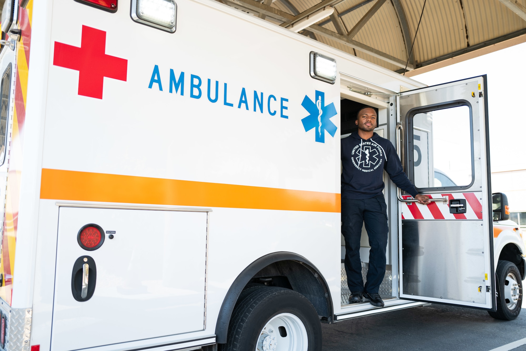 Airman standing in an ambulance