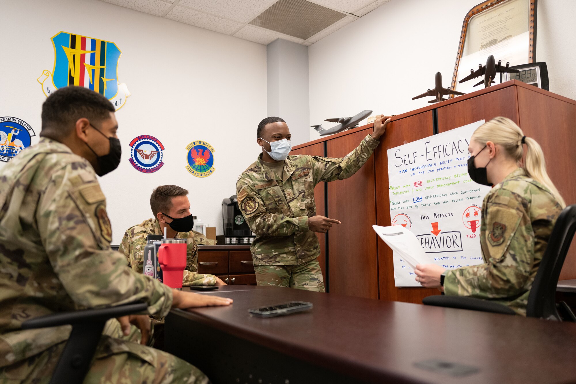 Airmen discussing school work