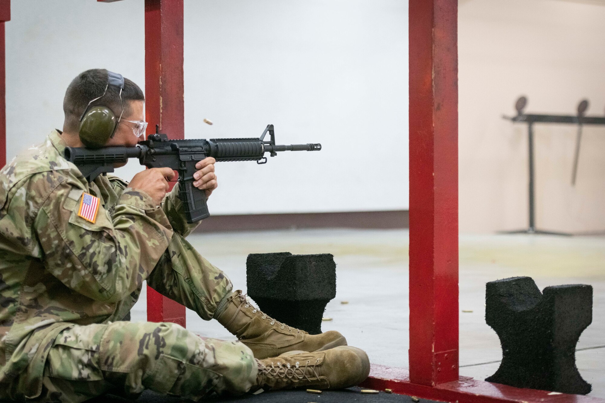 U.S. Army Lt. Col. Daniel Brady, United States Forces Japan facilities and real estate branch chief, fires in the sitting position during the Excellence in Competition Sept. 15, 2022, at Yokota Air Base, Japan.