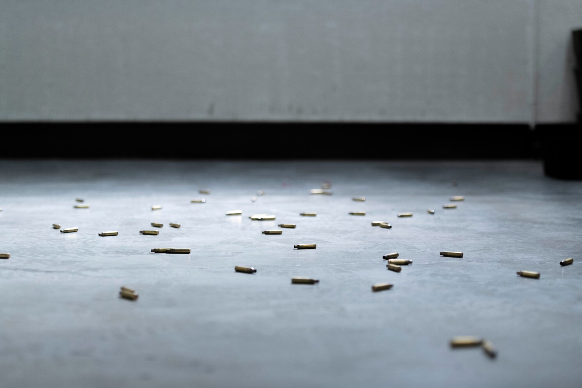 Expended shell casings from an M4 carbine lay on the Combat Arms Training and Maintenance firing range Sept. 15, 2022, at Yokota Air Base, Japan.