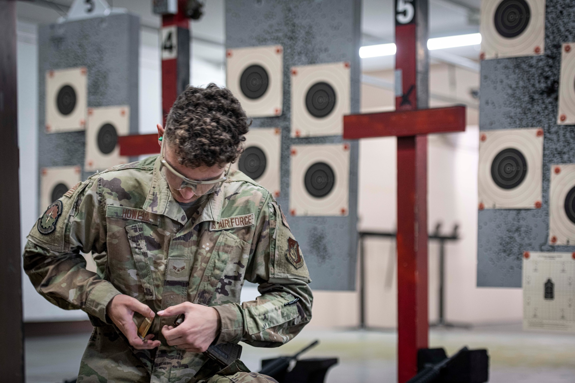 Airman 1st Class Tristan Howell, 374th Aircraft Maintenance Squadron aircraft hydraulic journeyman, loads ammunition into a magazine during the Excellence in Competition Sept. 15, 2022, at Yokota Air Base, Japan.