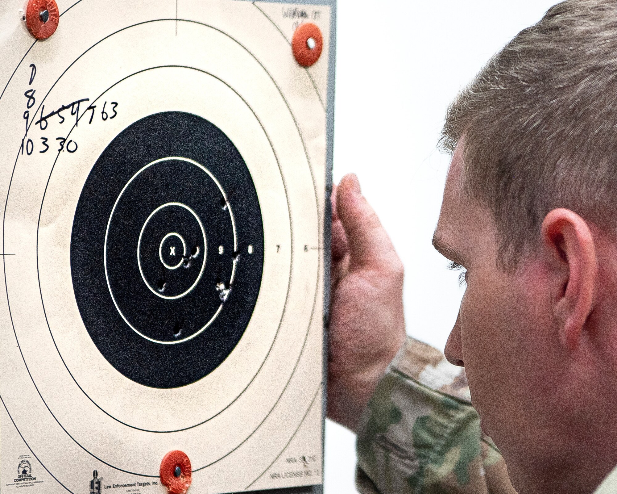 An Airman checks his target during the Excellence in Competition Sept. 15, 2022, at Yokota Air Base, Japan.