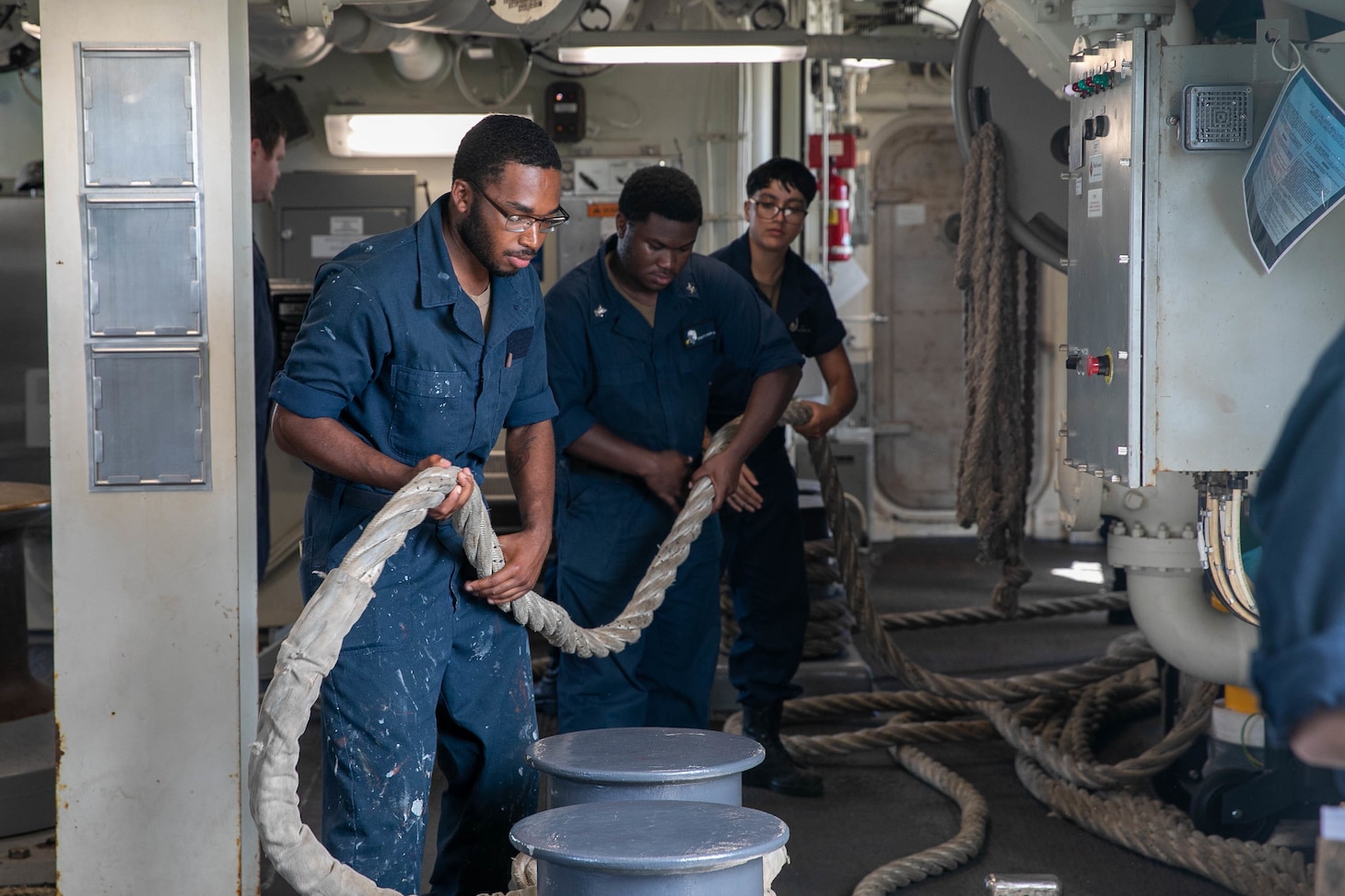 NAVAL BASE GUAM (Sept. 9, 2022) – Seaman Amin Moffett, from Memphis, handles line in preparation to get underway aboard guided-missile destroyer USS Zumwalt (DDG 1000) on Naval Base Guam, Sept. 9. Zumwalt is conducting underway operations in support of a free and open Indo-Pacific. (U.S. Navy photo by Mass Communication Specialist 2nd Class Jaimar Carson Bondurant)