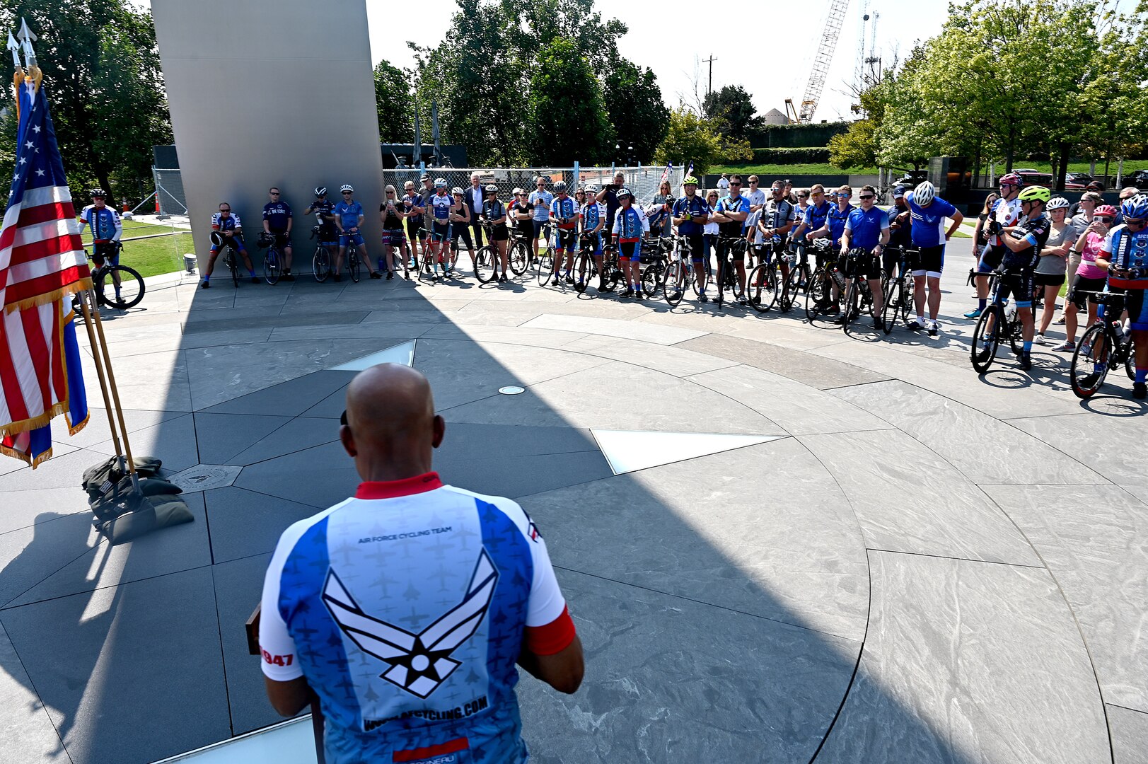male cyclist speaks to group of cyclists