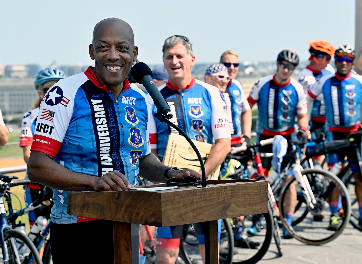 male cyclist shares a laugh with a group of cyclists