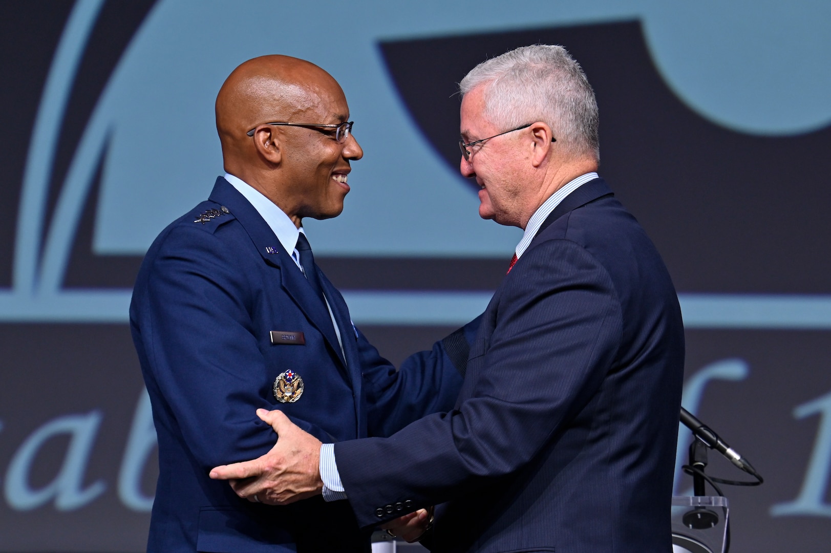 Air Force Chief of Staff Gen. CQ Brown, Jr. greets Gerald Murray, Air and Space Forces Association chairman of the board, after Brown delivered a keynote address on the state of the Air Force during the 2022 Air and Space Forces Association’s Air, Space and Cyber Conference in National Harbor, Md., Sept. 19, 2022. (U.S. Air Force photo by Eric Dietrich)