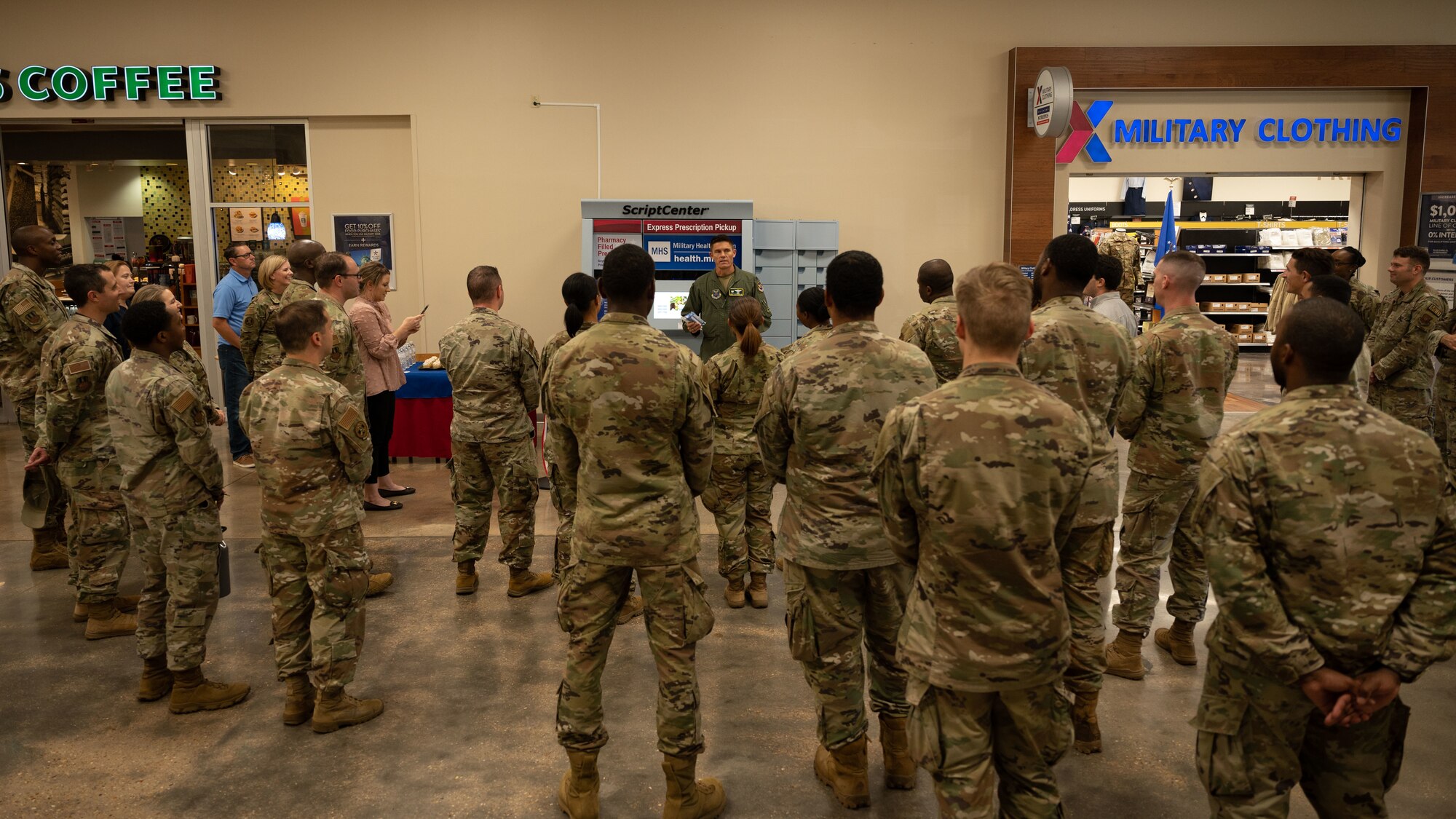 Barksdale Airmen and civilians gather at the Base Exchange for a ribbon cutting ceremony at Barksdale Air Force Base, Louisiana, Sept. 13, 2022. The ScriptCenter Kiosk grants access to pharmacy prescriptions any time the Base Exchange is open. (U.S. Air Force photo by Senior Airman Chase Sullivan)