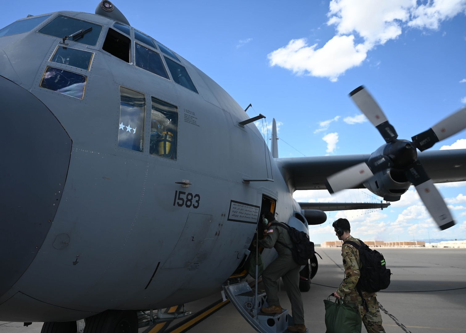 A photo of Airmen stepping onto an aircraft.