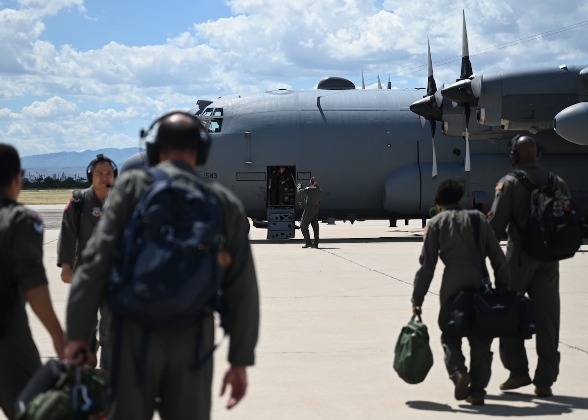 A photo of Airmen walking to an aircraft.