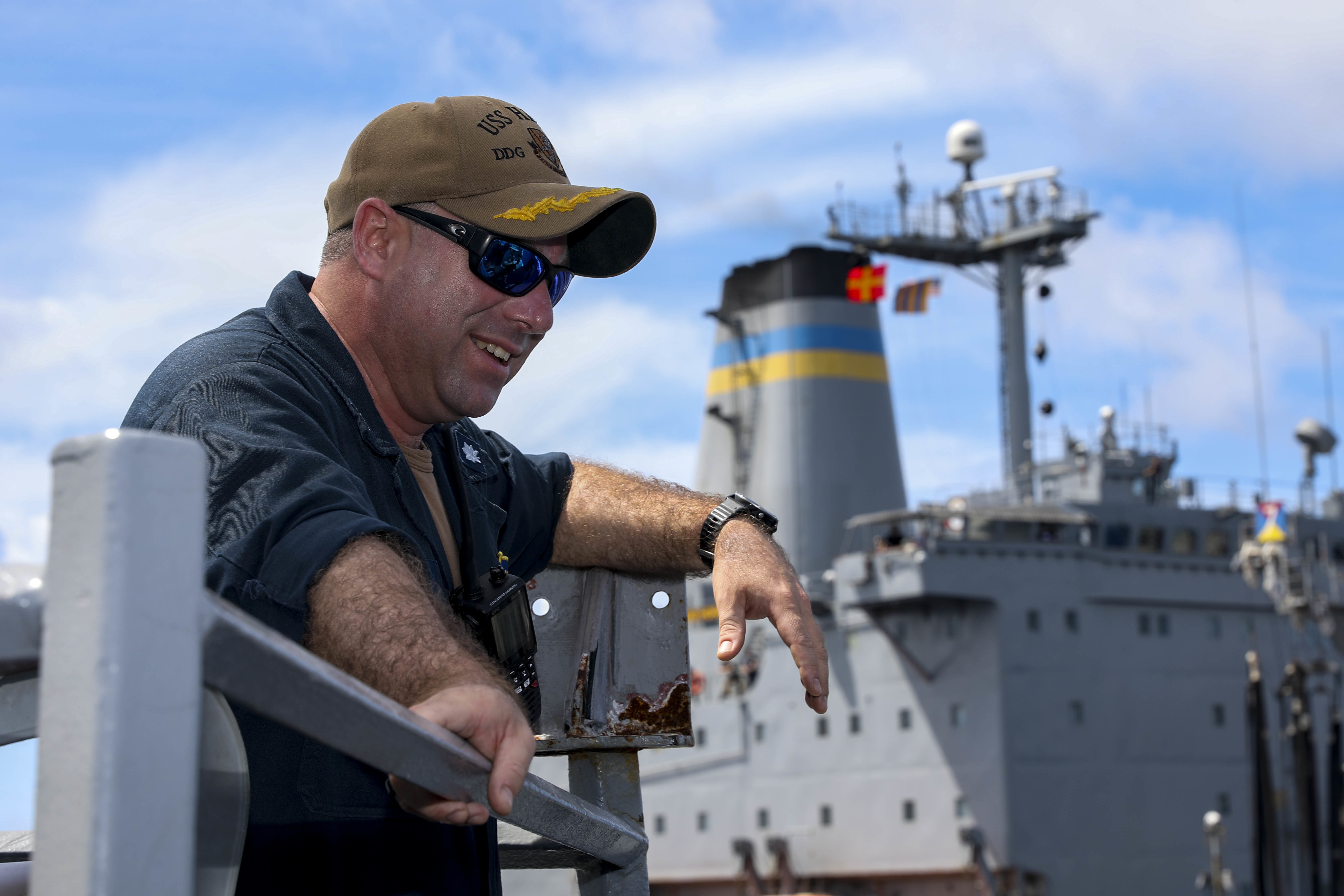 SOUTH CHINA SEA (Sept. 12, 2022) Cmdr. Joseph McGettigan, commanding officer of Arleigh Burke-class guided-missile destroyer USS Higgins (DDG 76) observes as the ship conducts a replenishment-at-sea with Henry J. Kaiser-class replenishment oiler USNS Big Horn (T-AO 198) in the South China Sea.