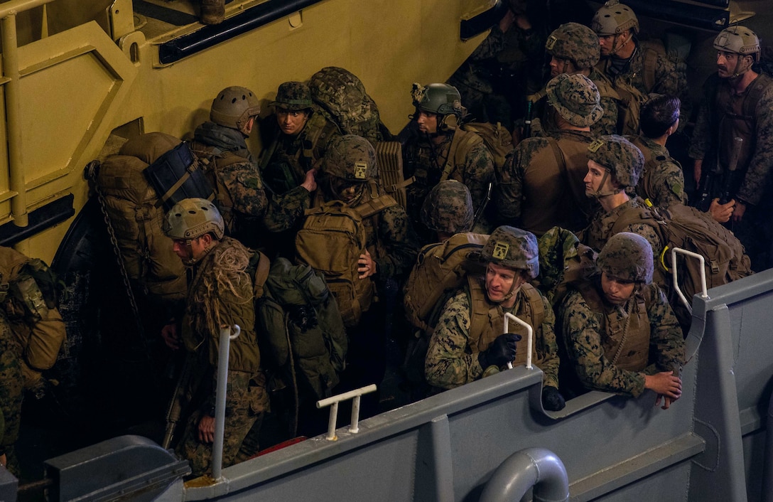 ATLANTIC OCEAN (Sept. 16, 2022) – U.S. Marines prepare to disembark a landing craft, utility (LCU) in the well deck of the amphibious landing dock ship USS Mesa Verde (LPD 19) after returning from a multi-national amphibious assault with Brazilian and Uruguayan marines, Sept. 16, 2022. Mesa Verde is currently underway in the Atlantic Ocean in support of exercise UNITAS LXIII. UNITAS is the world’s longest-running maritime exercise. Hosted this year by Brazil, it brings together multinational forces from Belize, Brazil, Cameroon, Chile, Colombia, Dominican Republic, Ecuador, France, Guyana, Jamaica, Mexico, Namibia, Panama, Paraguay, Peru, South Korea, Spain, United Kingdom, Uruguay, and the United States conducting operations in and off the coast of Rio de Janeiro. The exercise trains forces to conduct joint maritime operations through the execution of anti-surface, anti-submarine, anti-air, amphibious and electronic warfare operations that enhance warfighting proficiency and increase interoperability among participating naval and marine forces. (U.S. Navy photo by Mass Communication Specialist 3rd Class Sydney Milligan)