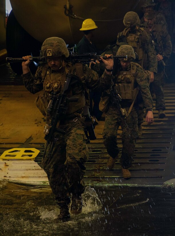 ATLANTIC OCEAN (Sept. 16, 2022) -- U.S. Marines disembark a landing craft, utility (LCU) in the well deck of the amphibious landing dock ship USS Mesa Verde (LPD 19) after returning from a multi-national amphibious assault with Brazilian and Uruguayan marines, Sept. 16, 2022. Mesa Verde is currently underway in the Atlantic Ocean in support of exercise UNITAS LXIII. UNITAS is the world’s longest-running maritime exercise. Hosted this year by Brazil, it brings together multinational forces from Belize, Brazil, Cameroon, Chile, Colombia, Dominican Republic, Ecuador, France, Guyana, Jamaica, Mexico, Namibia, Panama, Paraguay, Peru, South Korea, Spain, United Kingdom, Uruguay, and the United States conducting operations in and off the coast of Rio de Janeiro. The exercise trains forces to conduct joint maritime operations through the execution of anti-surface, anti-submarine, anti-air, amphibious and electronic warfare operations that enhance warfighting proficiency and increase interoperability among participating naval and marine forces. (U.S. Navy photo by Mass Communication Specialist 3rd Class Sydney Milligan)