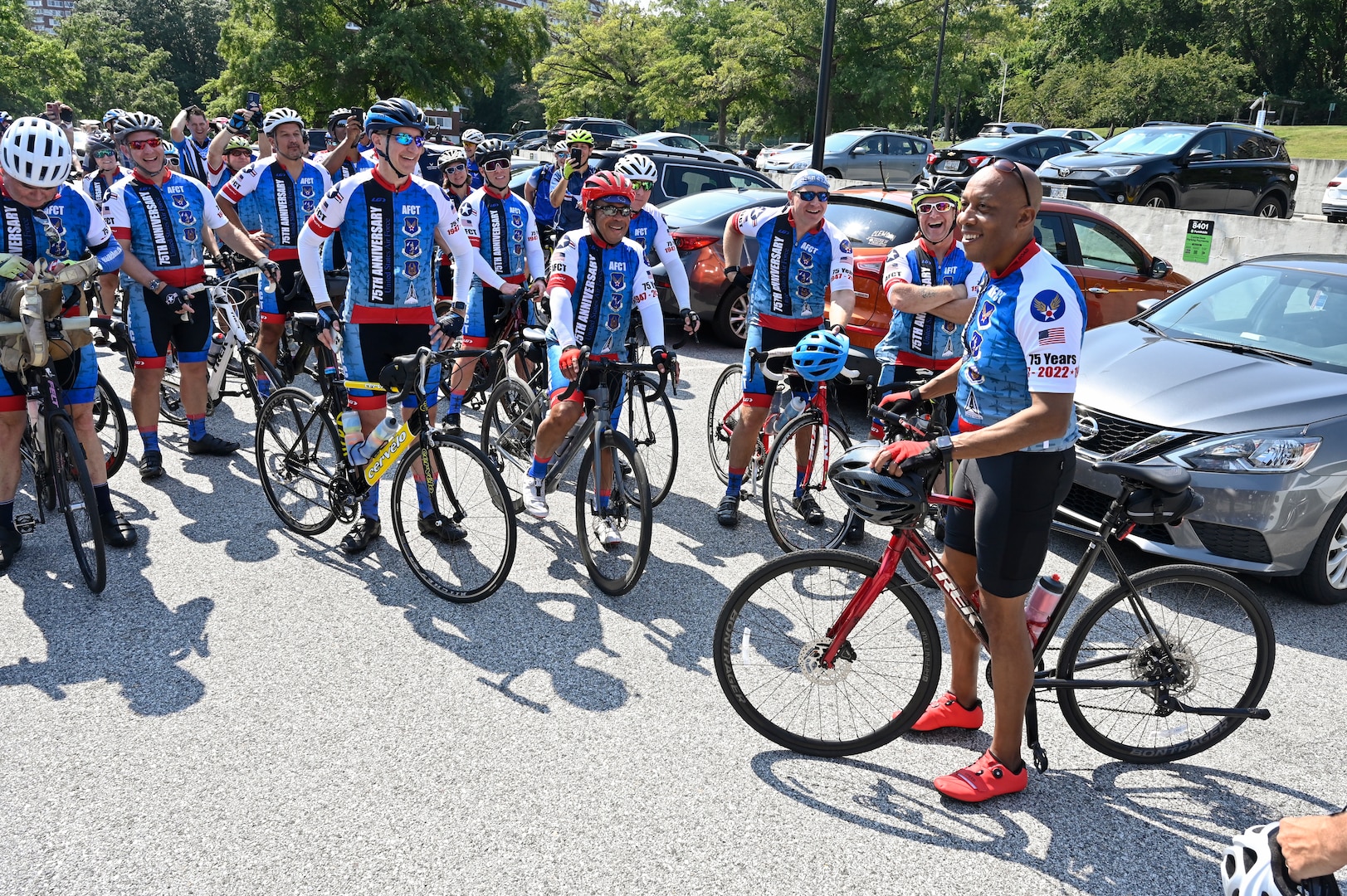 male cyclist speaks to group of cyclists