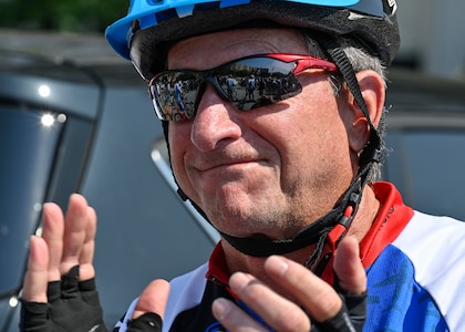 male cyclist clapping