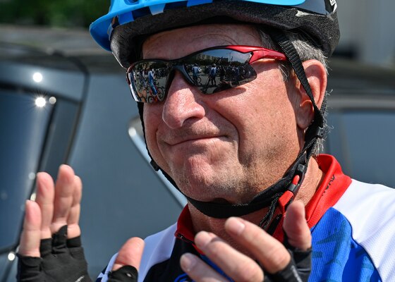 male cyclist clapping