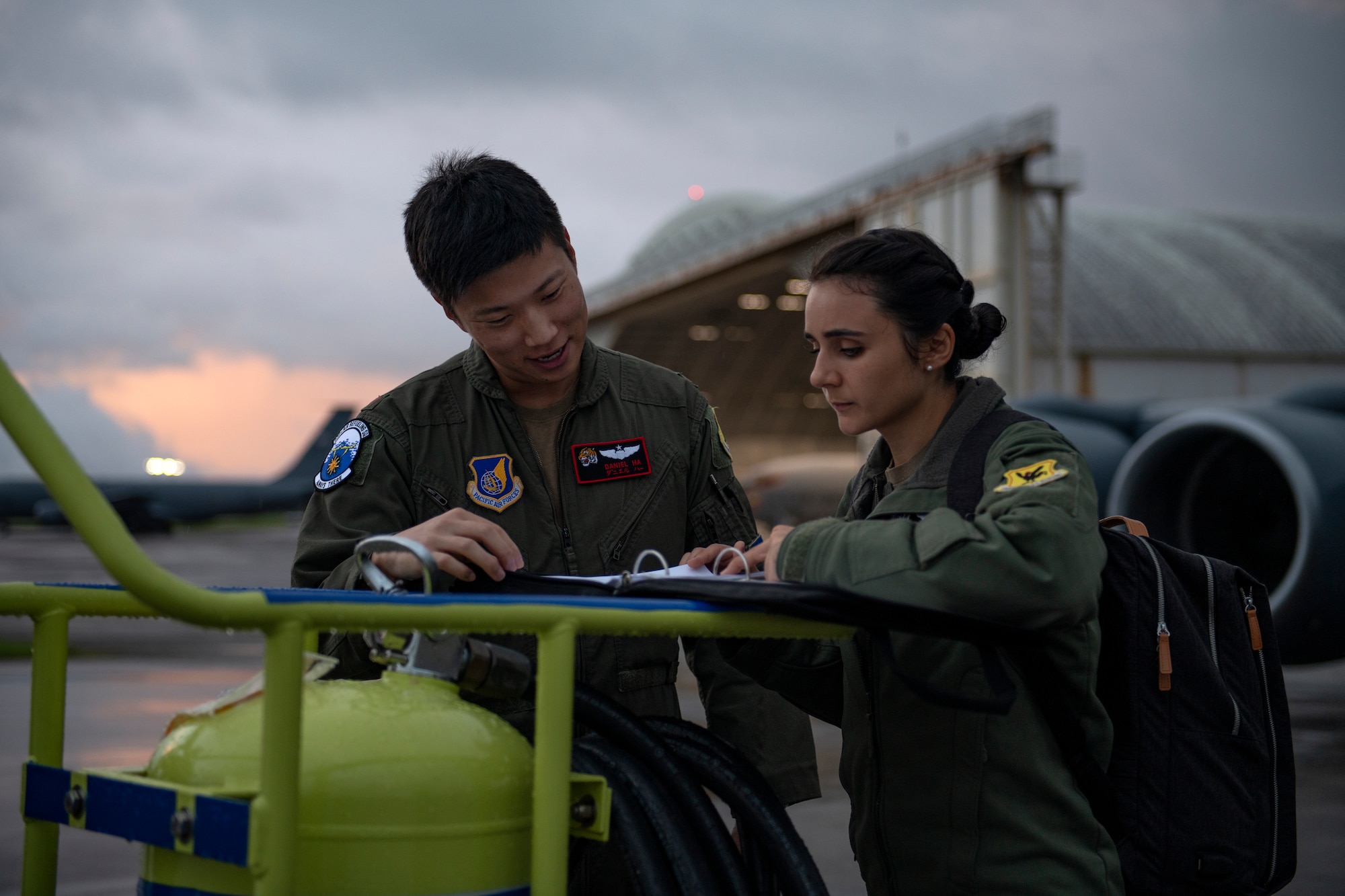 U.S. Air Force Maj. Daniel Ha and Capt. Jessica Wallander, 909th Air Refueling Squadron KC-135 Stratotanker pilots, review the flight plan prior to a refueling mission in support of Exercise Southern Beach at Kadena Air Base, Japan, Sept. 15, 2022. Exercise Southern Beach is part of a continual effort to enhance interoperability between U.S. Forces and host nations, building a partnership that can effectively operate high-end missions in defense of a free and open Indo-Pacific region. (U.S. Air Force photo by Senior Airman Jessi Roth)