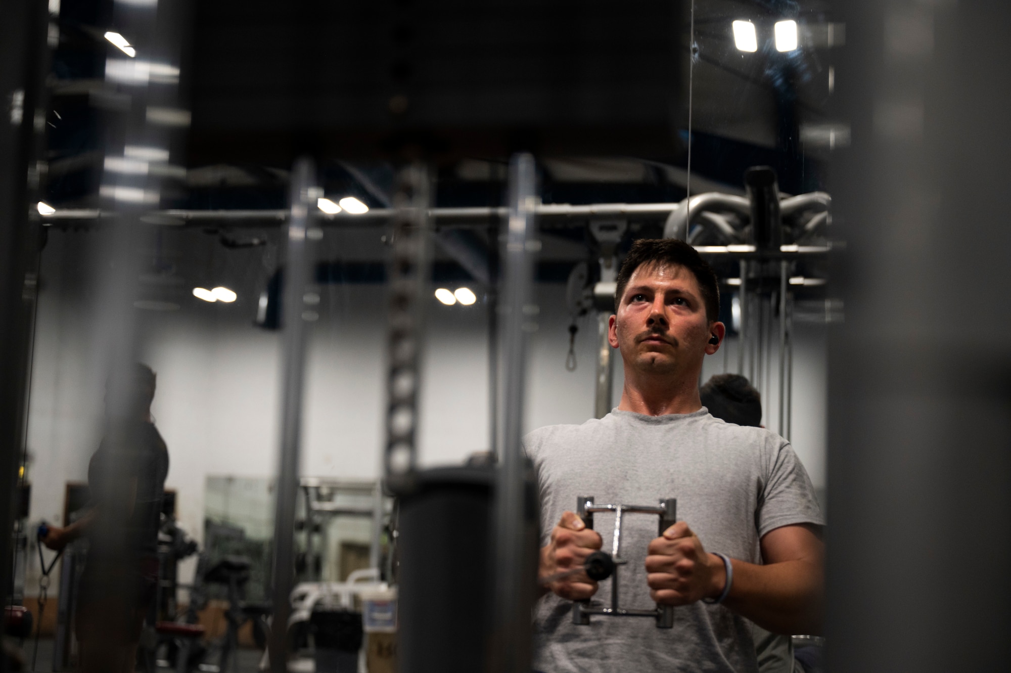 U.S. Air Force Staff Sgt. Brian Jones, 386th Expeditionary Civil Engineer Squadron firefighter, works out at the end of his shift during Operation Agile Spartan III at an undisclosed location, September 8, 2022. Arriving at the location, 386th ECES Airmen were able to make any necessary repairs to any facilities quickly and were able to bring them back to a mission capable status. (U.S. Air Force photo by Staff Sgt. Dalton Williams)