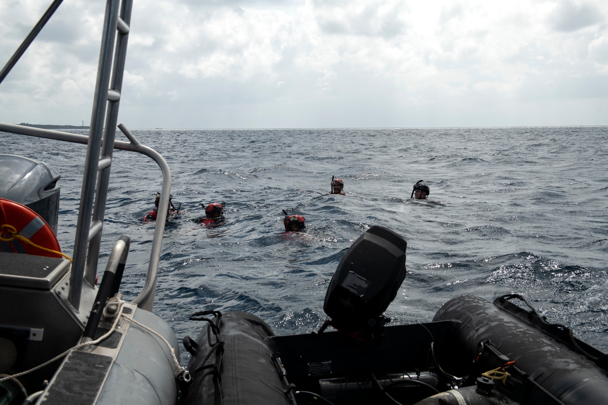 U.S. Air Force pararescuemen assigned to the 31st Rescue Squadron prepare to be extracted by an HH-60G Pave Hawk during an amphibious search and rescue training in the Pacific Ocean, Sept. 13, 2022. PJ’s are trained, equipped and postured to conduct full spectrum personnel recovery operations in both peacetime and combat environments. (U.S. Air Force photo by Senior Airman Jessi Roth)