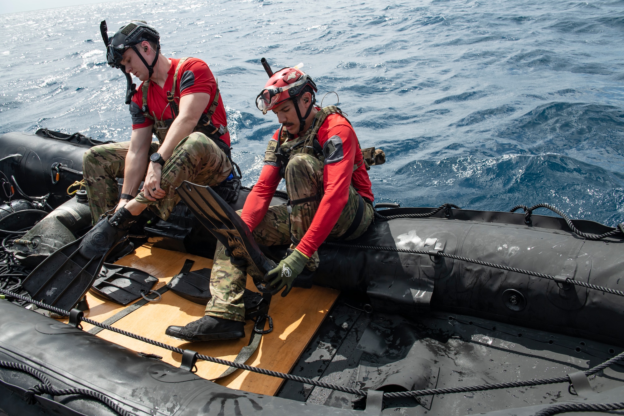 U.S. Air Force pararescuemen assigned to the 31st Rescue Squadron prepare to enter the water and swim to an extraction point during an amphibious search and rescue training in the Pacific Ocean, Sept. 13, 2022. The training was conducted to enhance alternate insertion and extraction method capabilities, ensuring RQS personnel are ready to rapidly respond at a moment's notice. (U.S. Air Force photo by Senior Airman Jessi Monte)