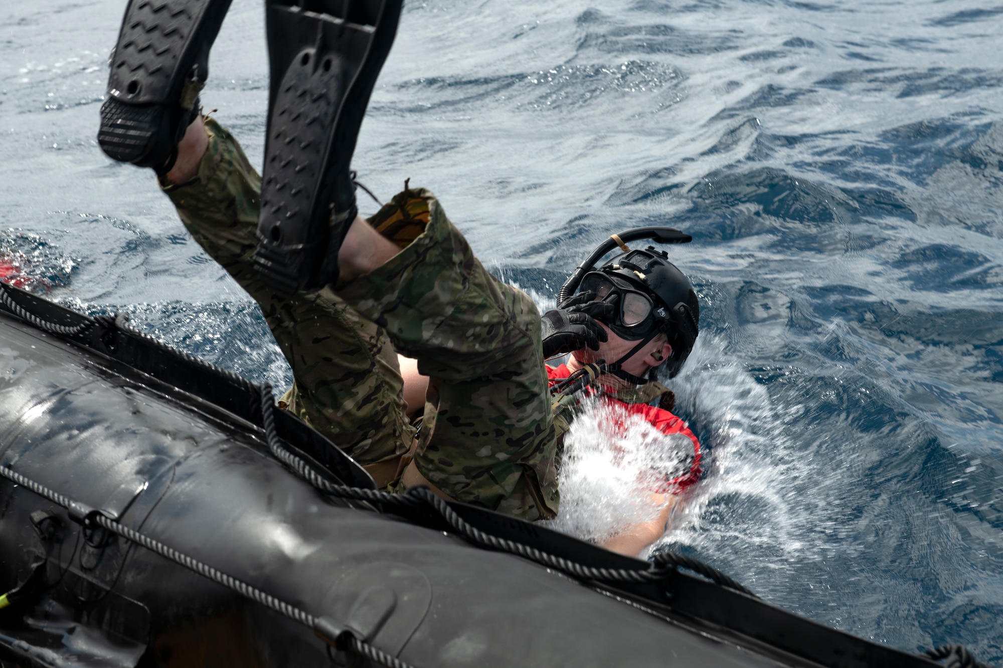 A U.S. Air Force pararescueman assigned to the 31st Rescue Squadron exits a combat rubber raiding craft during an amphibious search and rescue training in the Pacific Ocean, Sept. 13, 2022. These training exercises are designed to posture RQS’s to respond quickly and effectively to a wide range of possible contingencies. (U.S. Air Force photo by Senior Airman Jessi Roth)