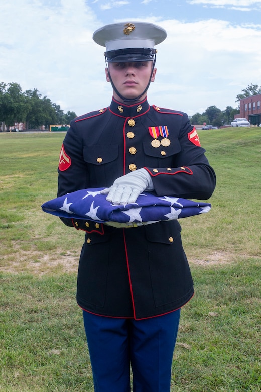 U.S. Marine Corps Lance Cpl. Christian Anthony, a native of Branchburg, New Jersey, assigned to the Marine Corps Base Quantico Ceremonial Platoon, practices presenting the American flag for a funeral detail at Marine Corps Base Quantico, Virginia, Aug. 17, 2022. The MCB Quantico Ceremonial Platoon provides color guard detail for on and off base events, to include: funerals, ceremonies, parades, and the raising and lowering of the colors. (U.S. Marine Corps photo by Lance Cpl. Keegan Bailey)