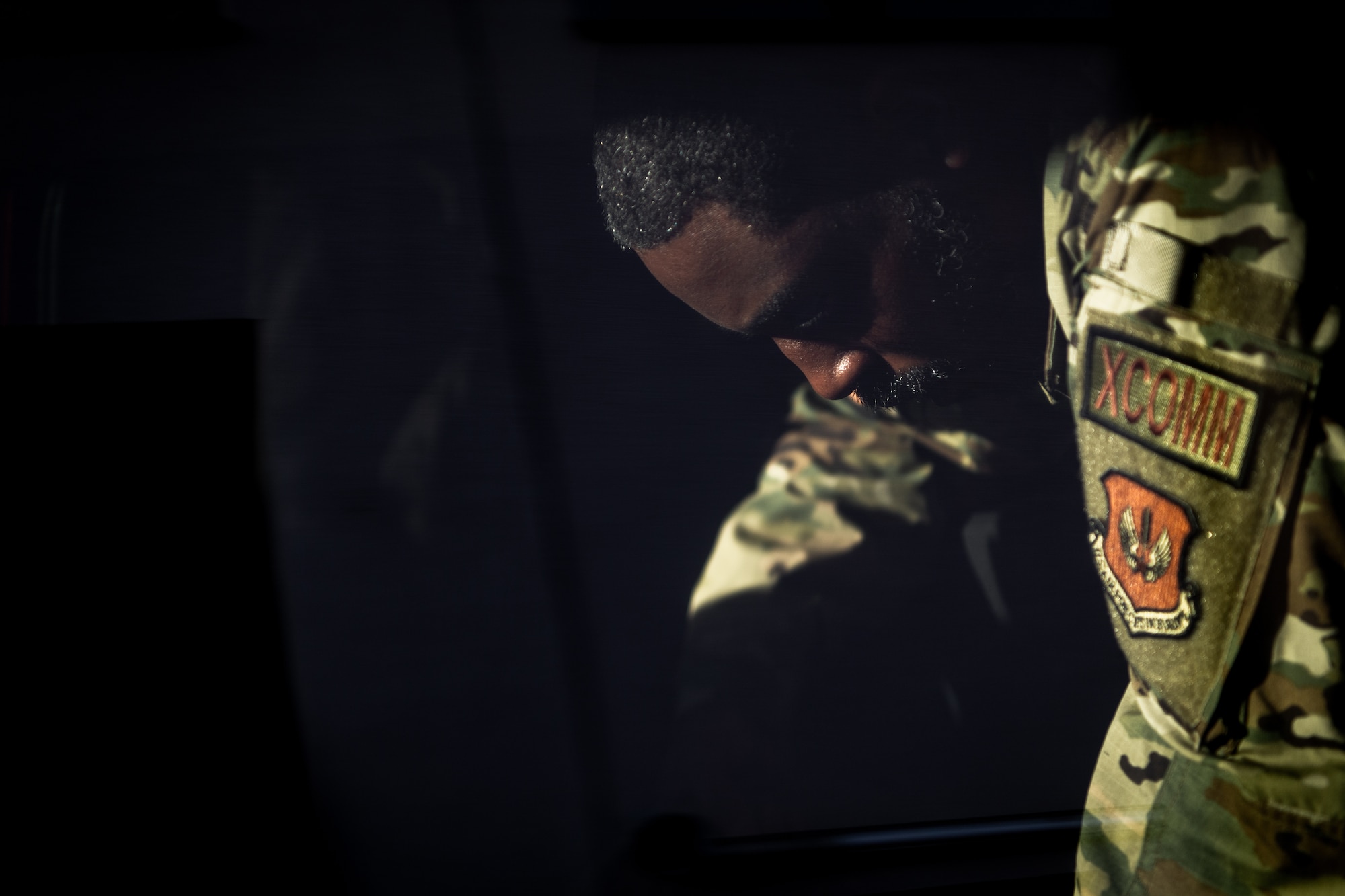 U.S. Air Force Tech. Sgt. Albert Redmon, 1st Combat Communications Squadron  flexible communications noncommissioned officer in charge, loads a van with equipment