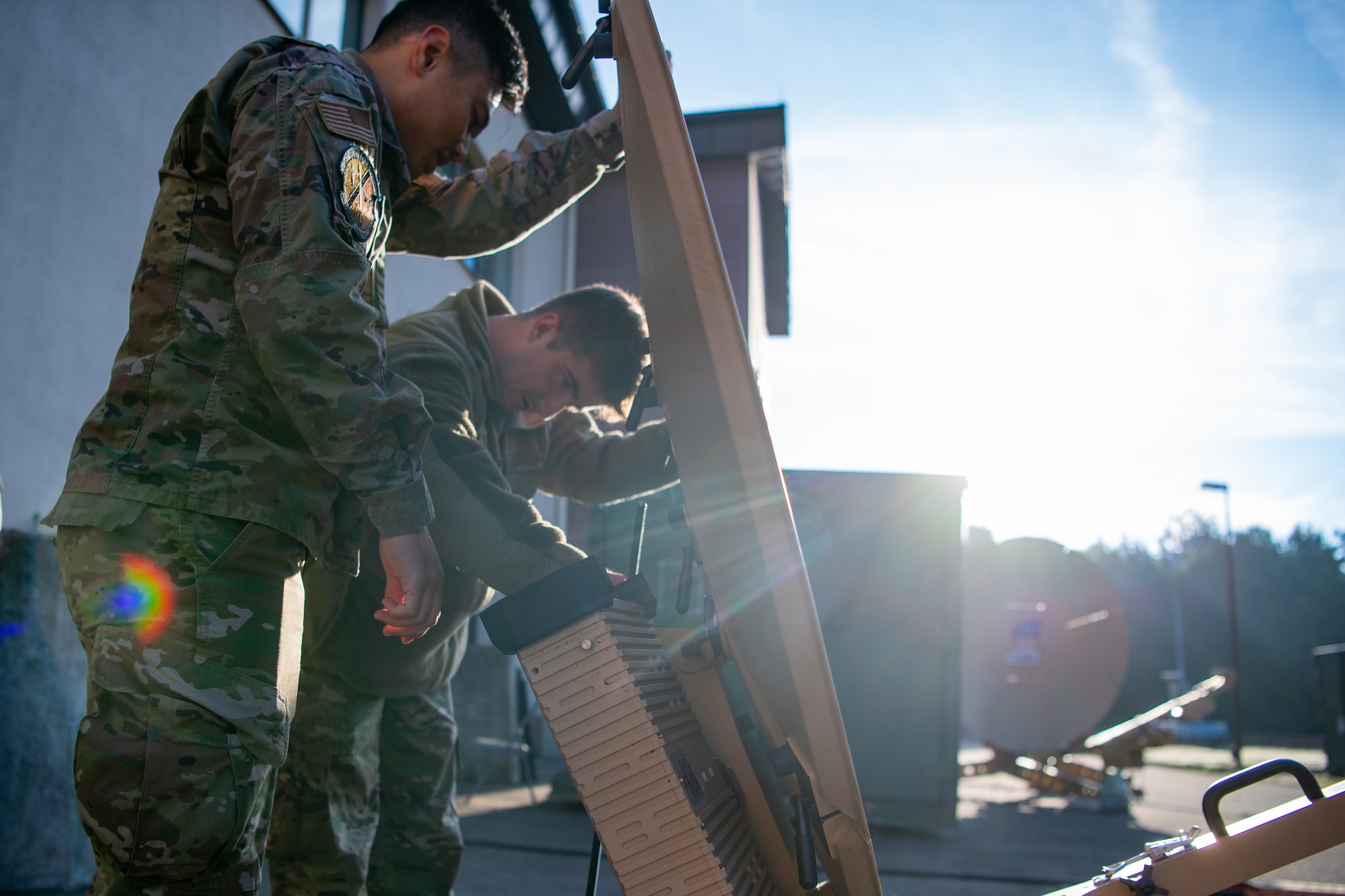 Airmen disassemble an antenna to respond to a simulated communication issue