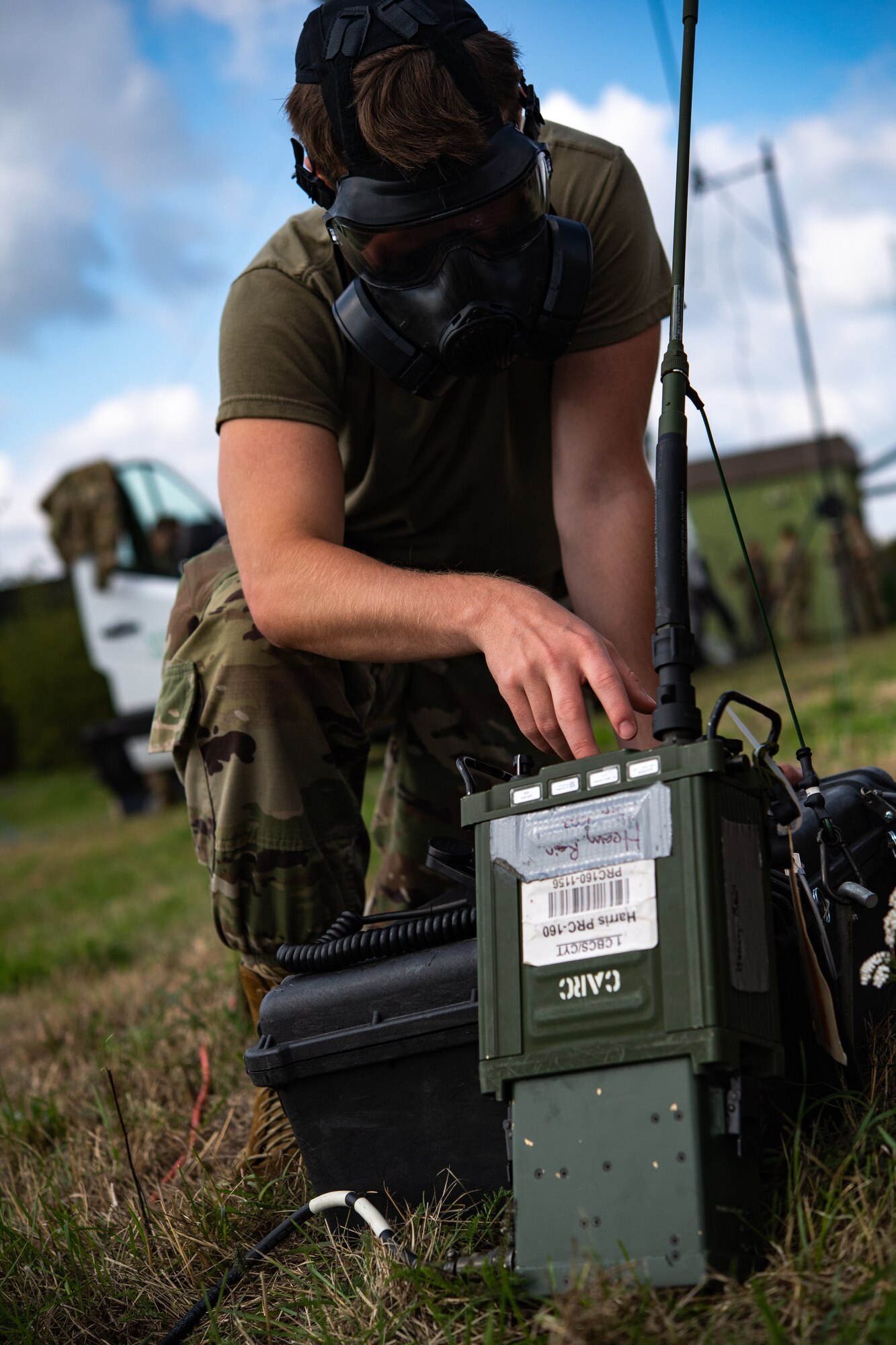 U.S. Air Force Airman 1st Class Markus McNally, 1st Combat Communications Squadron client systems technician, operates a radio