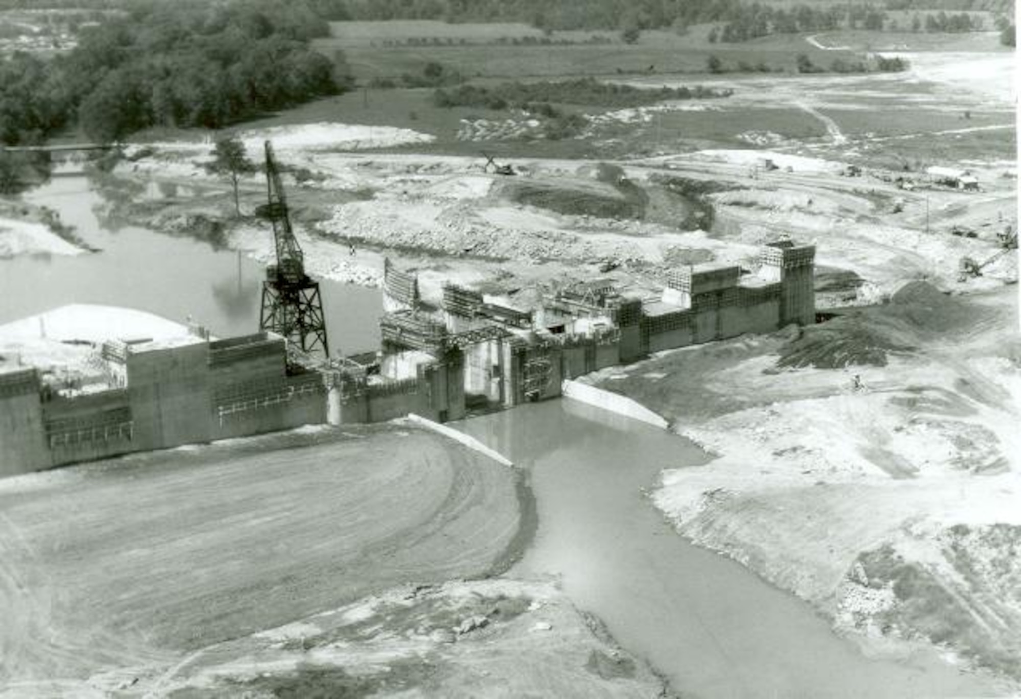 An aerial view of construction on the Elk River Dam is seen in this photo from the 1950s. The dam, constructed to create Woods Reservoir, was completed 70 years ago this month. Woods Reservoir has since supplied cooling water to the test facilities at Arnold Air Force Base, Tennessee. Arnold AFB is the headquarters of the Arnold Engineering Development Complex. (U.S. Air Force photo)