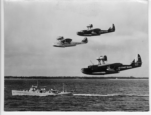 A 165-ft cutter passed overhead by three USCG flying boats