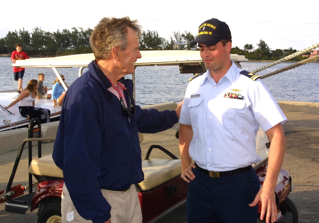 Lt. Craig Neubecker, HITRON-10 Aviation Mission commander,  meet with President George H.W. Bush.  President Bush wanted to thank the Coast Guard crew for their help in the homeland defense of the country and their efforts to fight the war on drugs.