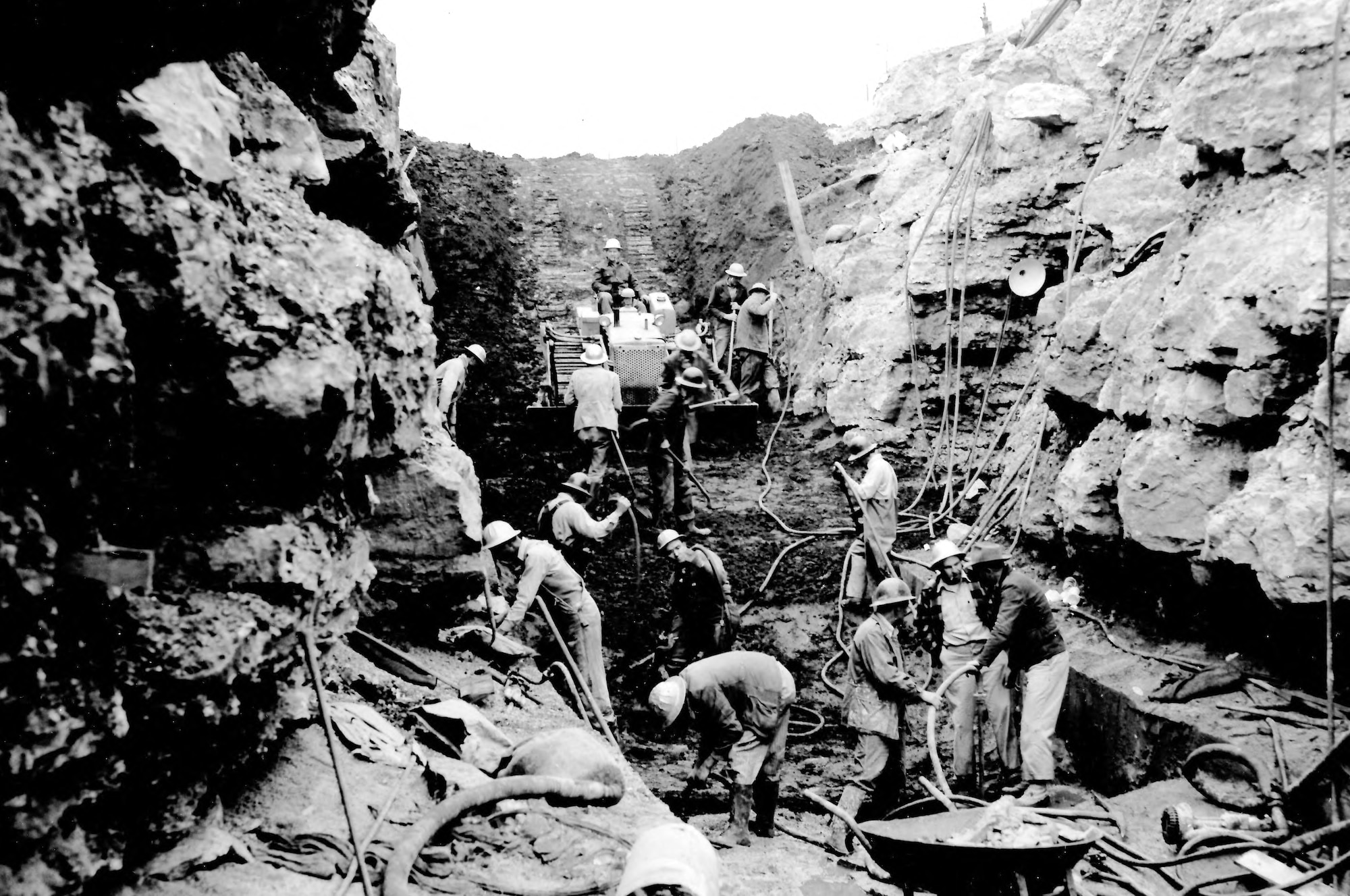 Crews work in April 1951 in the north end core trench of what would soon become the Elk River Dam. The dam, constructed to create Woods Reservoir, was completed 70 years ago this month. Woods Reservoir has since supplied cooling water to the test facilities at Arnold Air Force Base, Tennessee. Arnold AFB is the headquarters of the Arnold Engineering Development Complex. (U.S. Air Force photo)