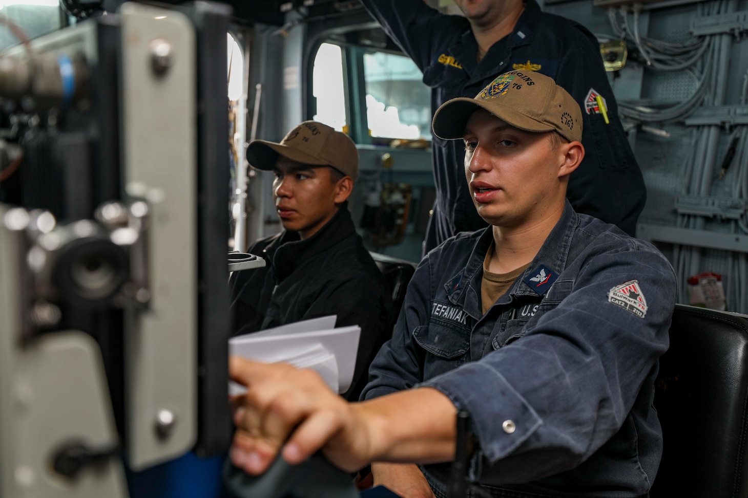 TAIWAN STRAIT (Sept. 20, 2022) Gunner’s Mate 3rd Class Chase Stefaniak, from South Bend, Indiana, mans the remote operating console for the 25mm gun, on the bridge of the guided-missile destroyer USS Higgins (DDG 76) as the ship conducts a routine Taiwan Strait. Higgins is forward-deployed to the U.S. 7th Fleet area of operations in support of a free and open Indo-Pacific. (U.S. Navy photo by Mass Communication Specialist 1st Class Donavan K. Patubo)