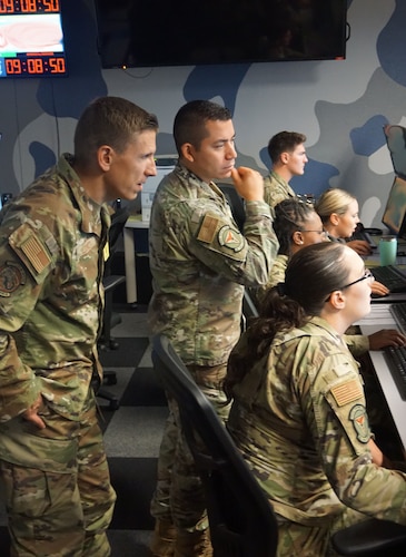 photo of US Military members working at computers