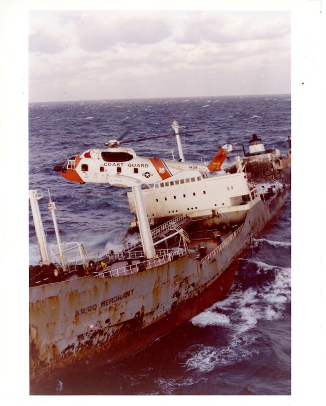 USCG HH-3 overflies the wreck of the SS Argo Merchant swirl in a sea of foam before being sucked under