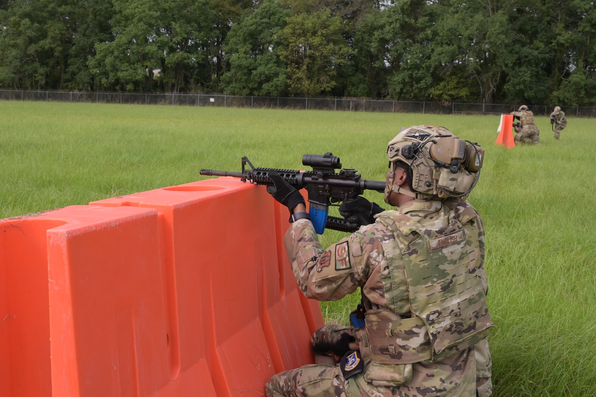 a man provides cover fire during a training event