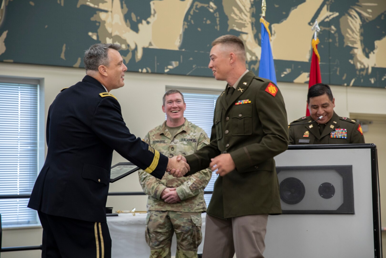 Brig. Gen. Thomas Mancino, the adjutant general for Oklahoma, congratulates newly commissioned 2nd Lt. Matthew Buck, Company B, 1st Battalion, 179th Infantry Regiment, 45th Infantry Brigade Combat Team, during Buck's OCS graduation in Norman Okla. Sept. 18, 2022 . Buck, along with 18 other Officer candidates, graduated and commissioned after attending OCS. (Oklahoma National Guard phot by Spc. Haden Tolbert)