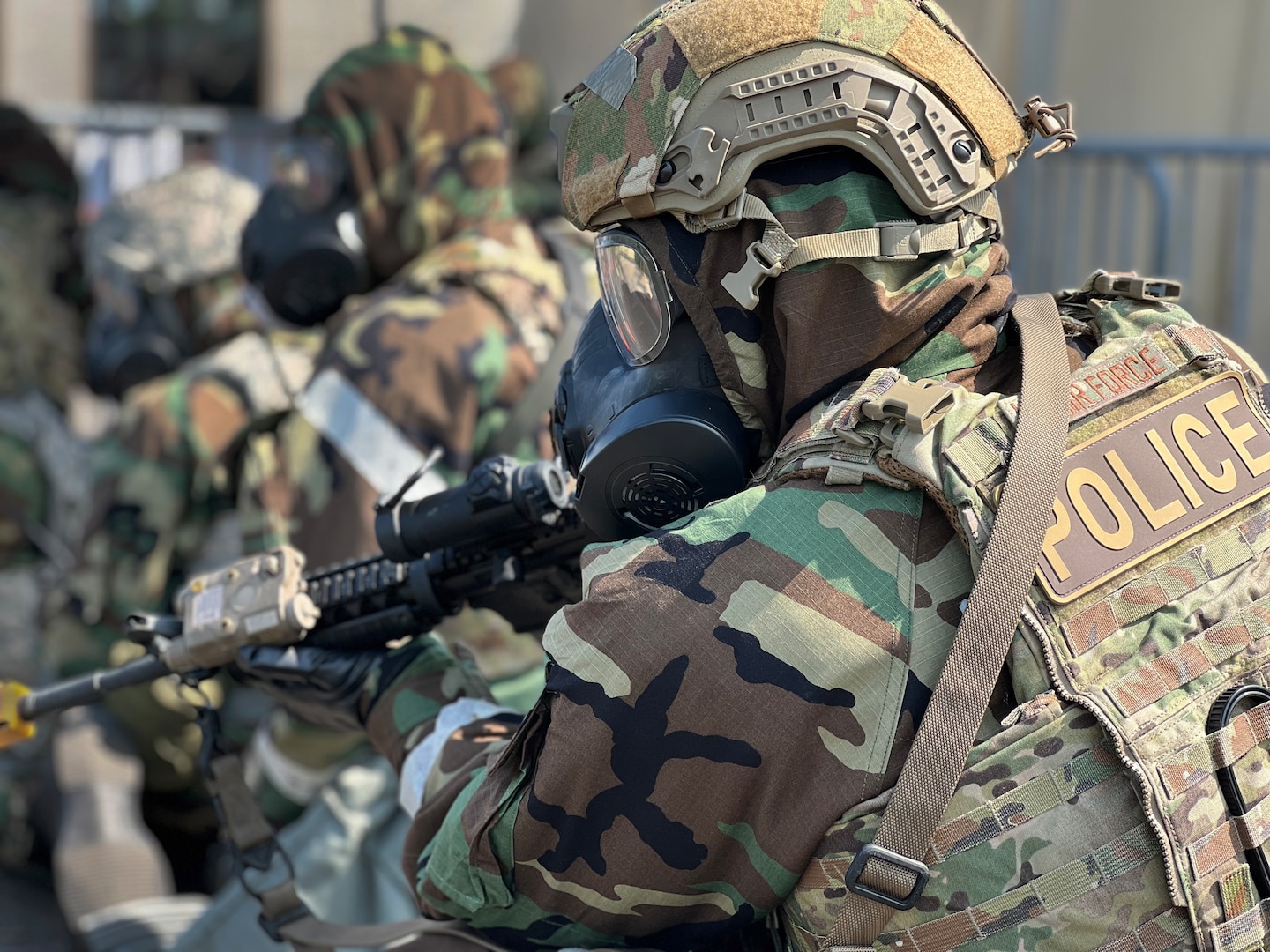 A member of the 111th Security Forces Squadron holds his weapon at the ready position while wearing Mission Oriented Protective Posture gear and body armor during a readiness exercise held by the 111th Attack Wing at Biddle Air National Guard Base in Horsham, Pennsylvania, Sept. 17, 2022.