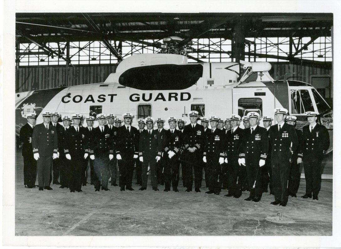 Officers from CG Air Station Kodiak muster in front of one of the station's Sikorsky HH-3s, no date.