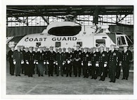 Officers from CG Air Station Kodiak muster in front of one of the station's Sikorsky HH-3s, no date.