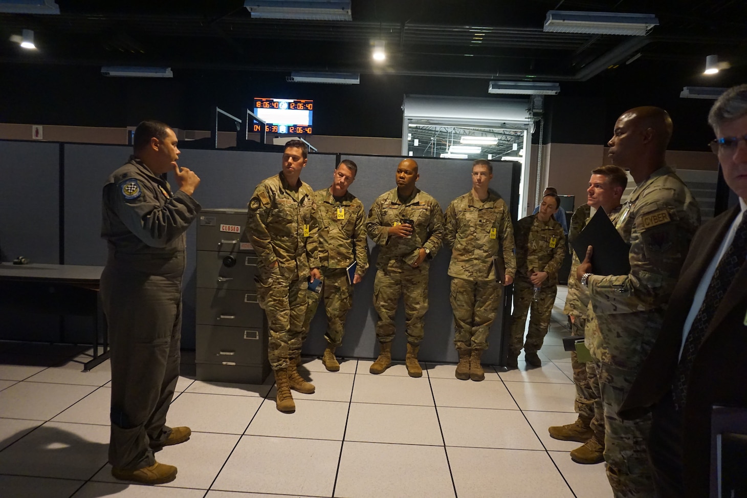 photo of US Military member standing and talking