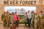 Gold Star Families and Colorado National Guard members visit the War on Terrorism Remembrance Memorial at Joint Force Headquarters, Centennial, Colorado, Sept. 11, 2022.  The Colorado National Guard unveiled the War on Terrorism Remembrance Memorial at JFHQ, Sept. 11.  The memorial features these CONG fallen service members: U.S. Army Sgt. 1st Class Daniel A. Romero, died April 15, 2002; U.S. Army Sgt. Luis R. Reyes, died Nov. 18, 2005; U.S. Army Sgt. Jon L. Stiles, died Nov. 13, 2008; U.S. Army Chief Warrant Officer 5 David R. Carter, Aug. 6, 2011; and, U.S. Army Sgt. 1st Class Liam J. Nevins, died Sept. 21, 2013. (U.S. Army National Guard photo by 1st Lt. Katherine Lee)