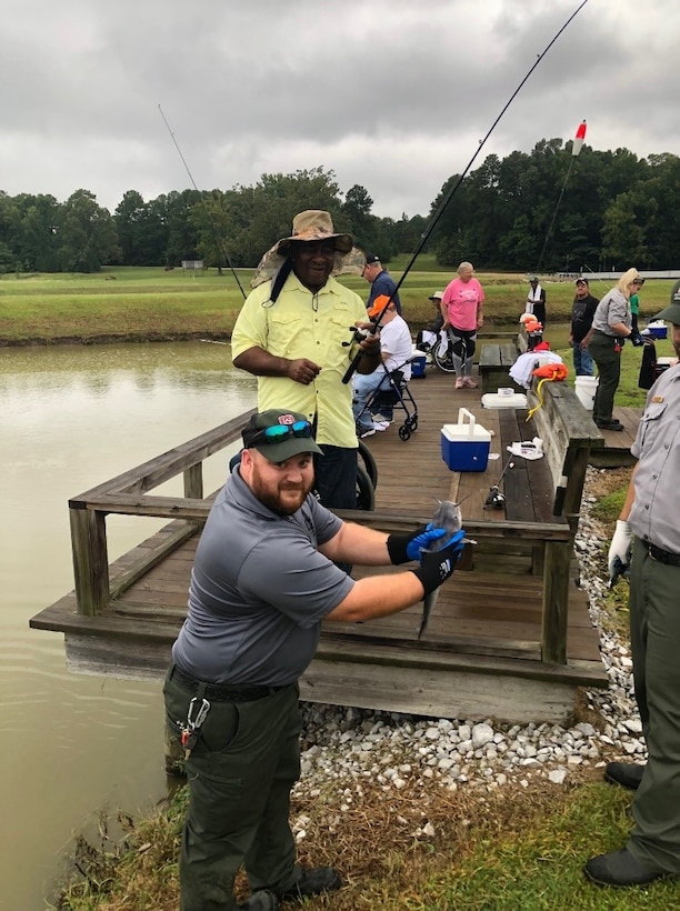 Participants, volunteers and ranger personnel enjoy a successful day of fishing at the North Mississippi Fish Hatchery during the 29th annual Physically Challenged Fishing Day at Enid Lake.